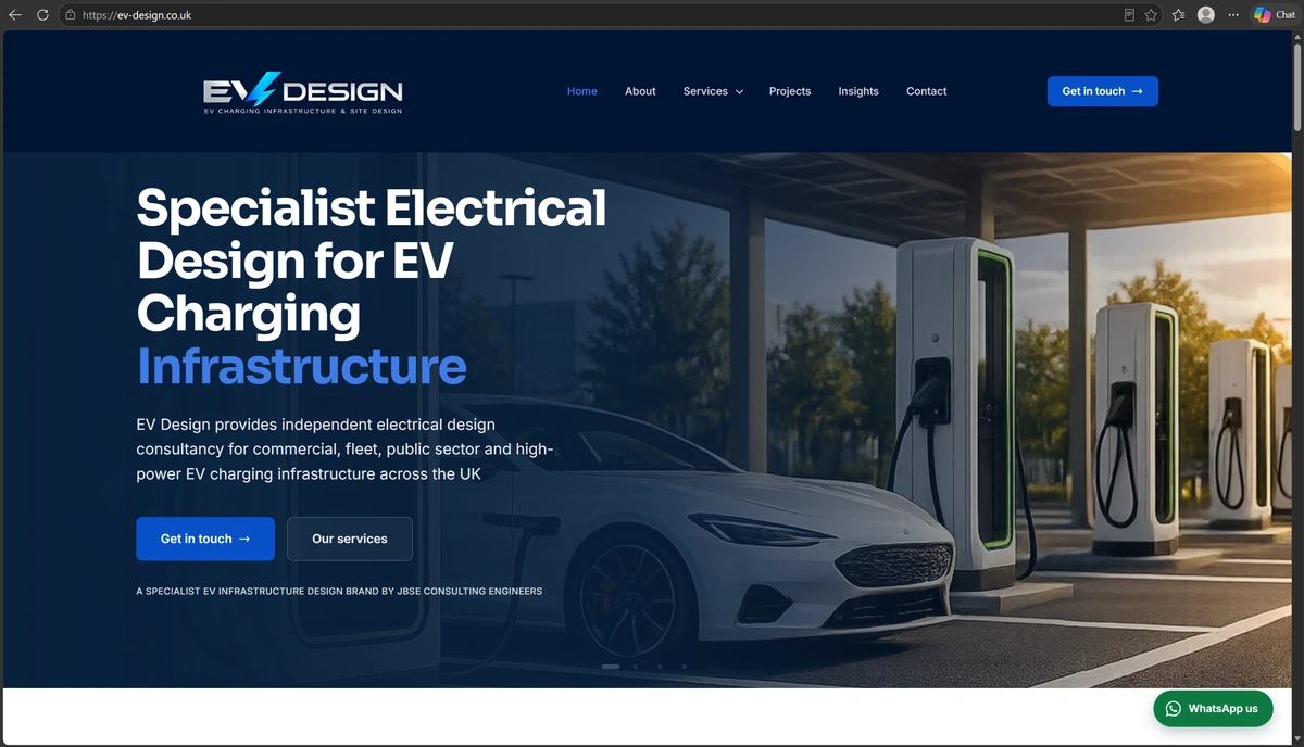 Homepage of ev-design.co.uk: dark navy header with the EV Design logo, a headline reading Specialist Electrical Design for EV Charging Infrastructure, and a photograph of a white car at a row of rapid chargers.